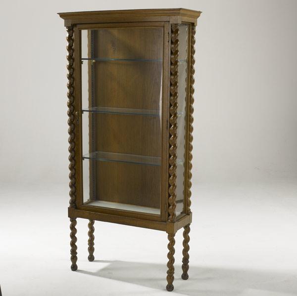 Appraisal: OAK CURIO CABINET With barley-twist columns and three glass shelves