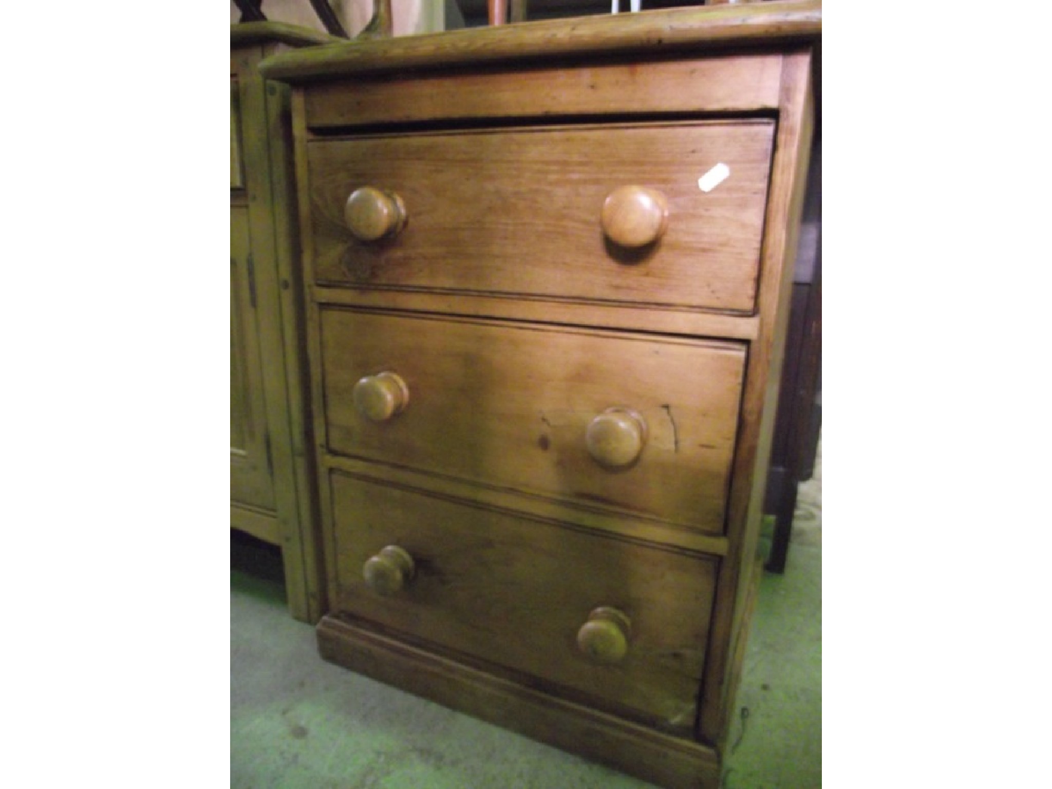 Appraisal: A small reclaimed pine three drawer pedestal chest with moulded