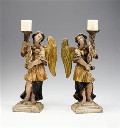 Appraisal: Pair of Italian polychromed figural altar sticks th century Each