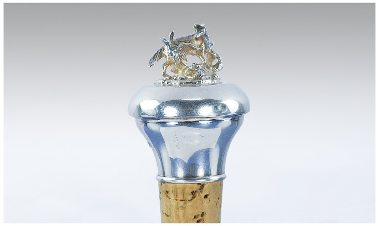 Appraisal: Silver and Cork Bottle Stop The top surmounted by a