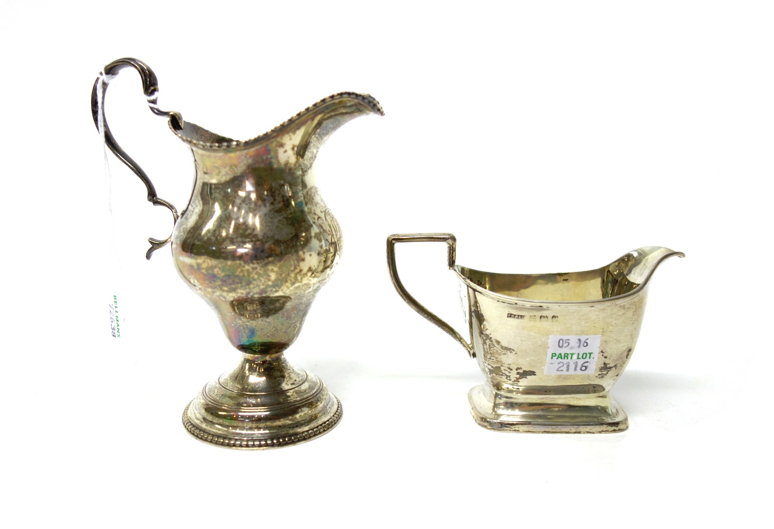 Appraisal: A George III silver cream jug of ogee form decorated