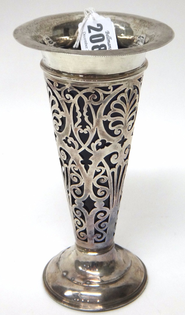 Appraisal: A silver vase with scroll pierced decoration on a weighted