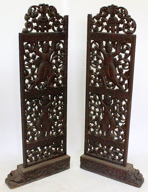 Appraisal: A PAIR OF OLD INDONESIAN CARVED HARDWOOD BOOKCASE SUPPORTS with