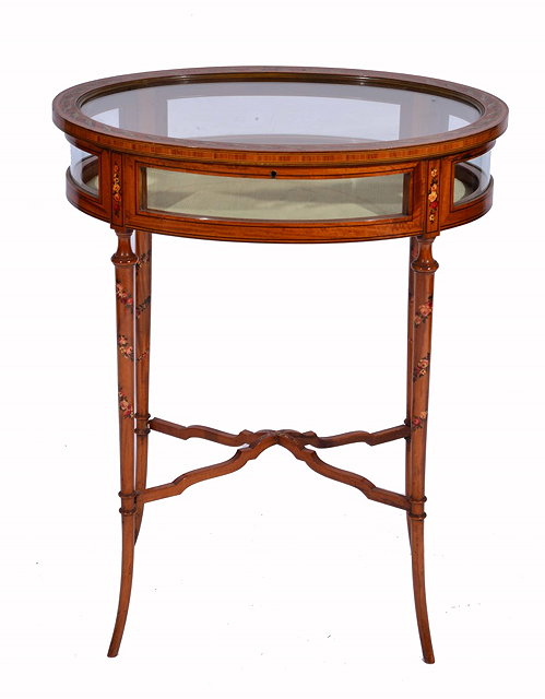 Appraisal: AN EDWARDIAN OVAL SATINWOOD AND CROSSBANDED TABLE TOP DISPLAY CABINET