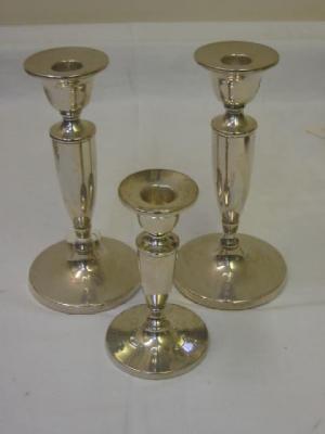 Appraisal: A PAIR OF CANDLESTICKS the urn shaped sconces on tapering