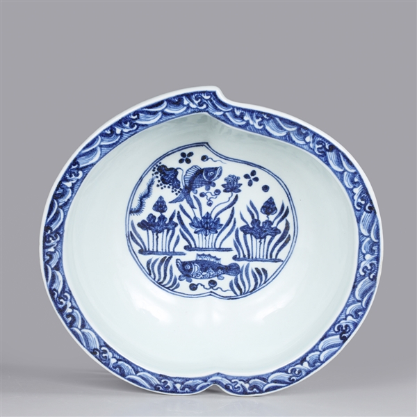 Appraisal: Chinese blue and white peach form basin with fish and