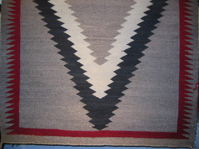 Appraisal: NAVAJO SADDLE BLANKET Natural tan field with central sawtooth diamond