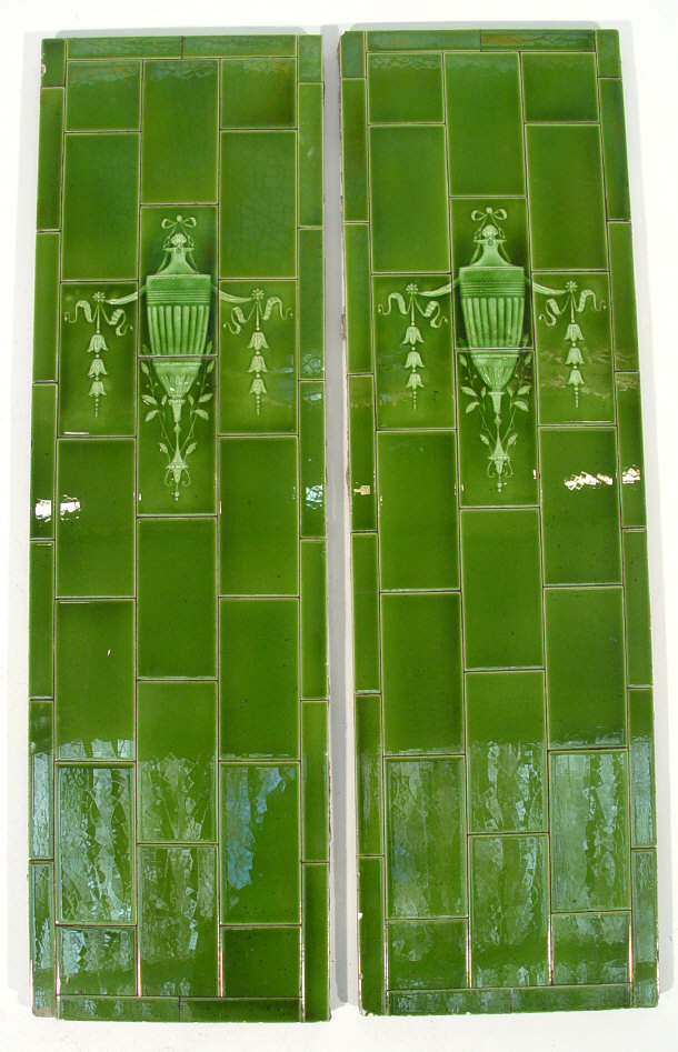 Appraisal: Two green glazed pottery tile panels with urn and swag