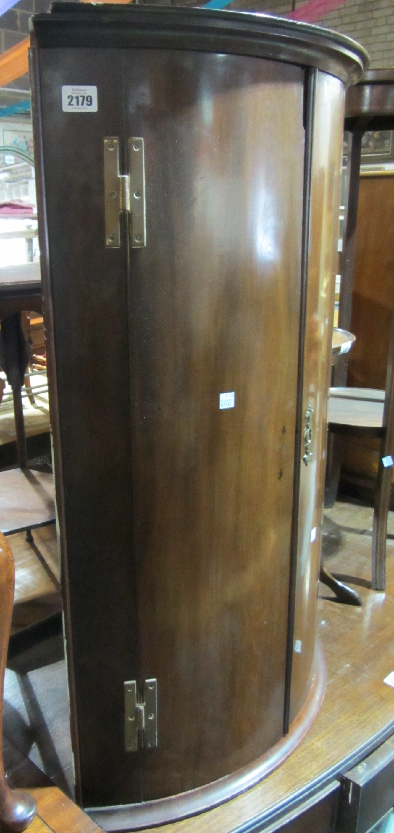 Appraisal: A th century mahogany bowfront hanging corner cupboard