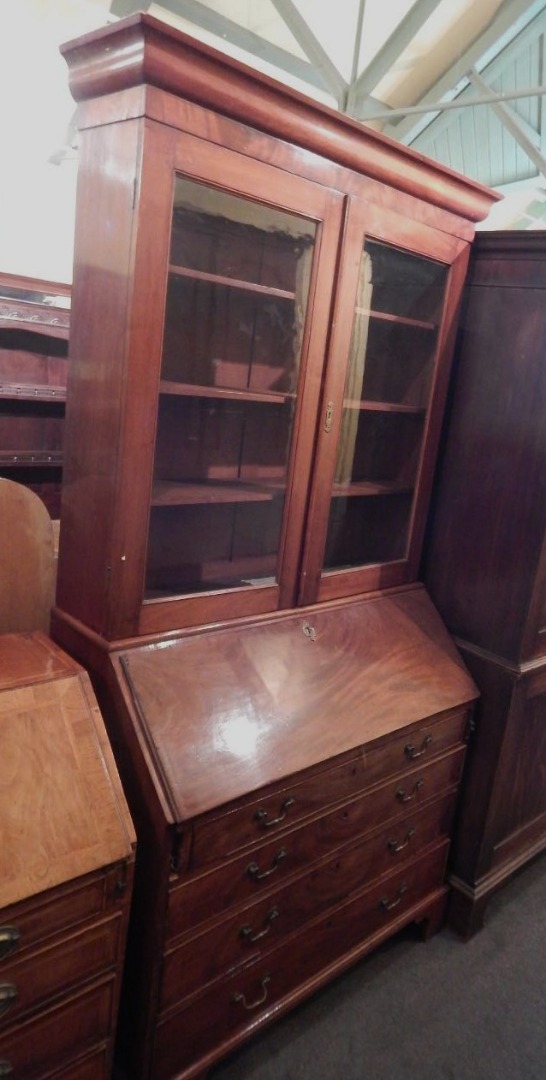 Appraisal: A thC mahogany bureau bookcase the top with a moulded