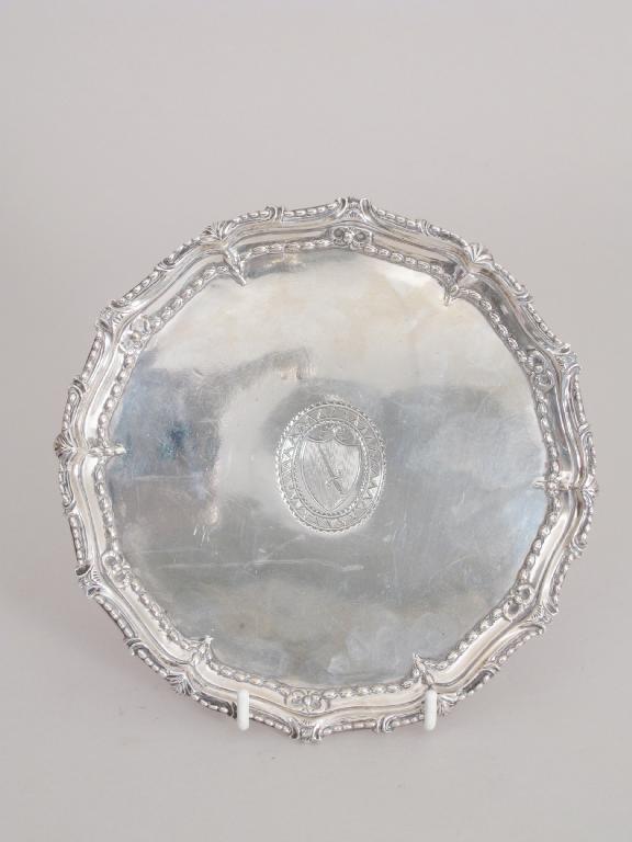 Appraisal: A George III circular Card Tray with engraved crest shaped