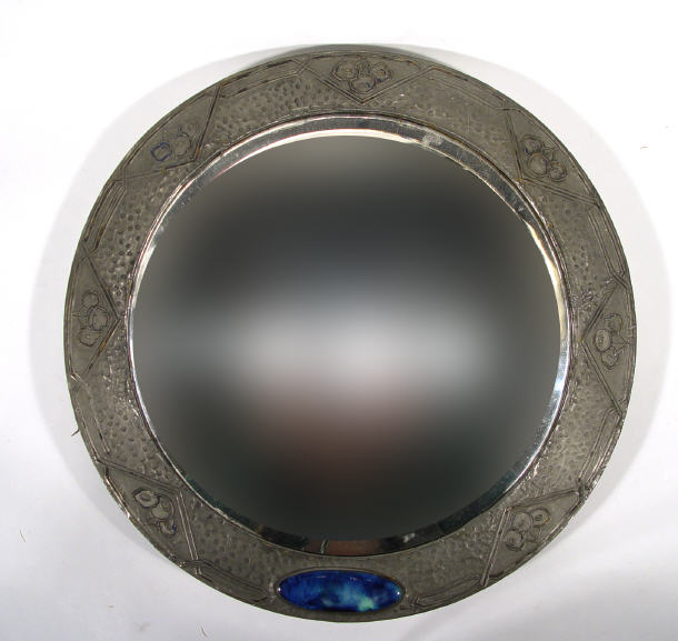 Appraisal: Circular Art Nouveau pewter framed mirror inset with a Ruskin