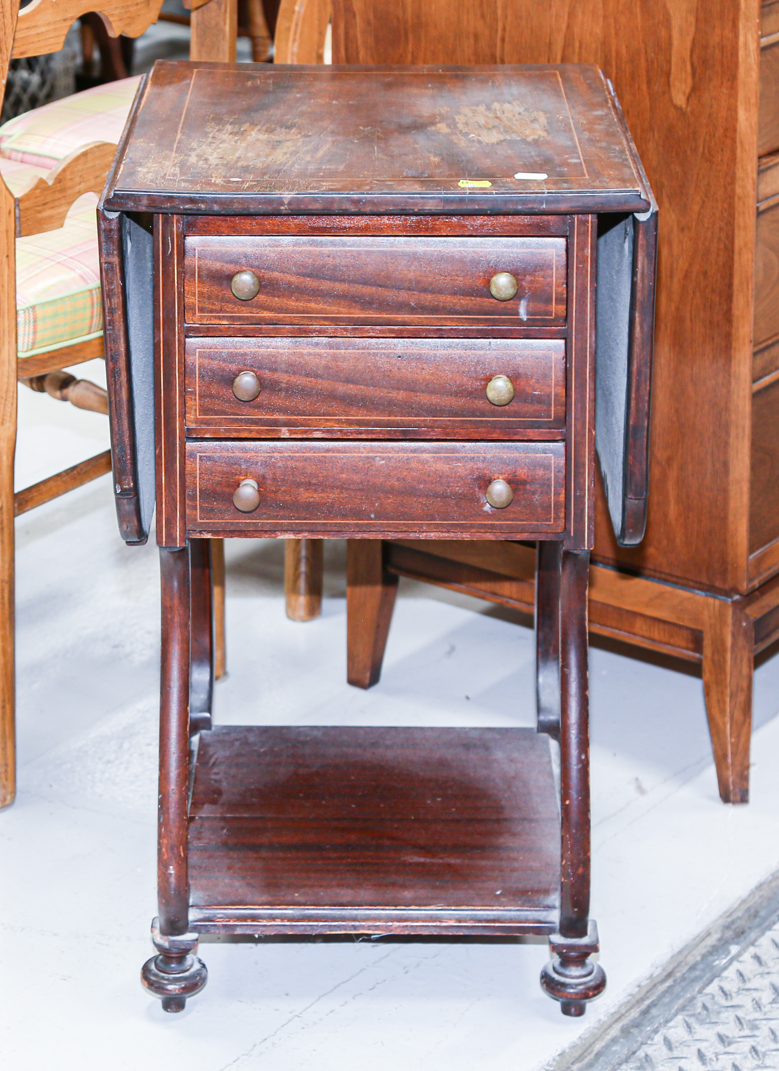 Appraisal: CLASSICAL STYLE MAHOGANY THREE-DRAWER STAND One drawer stenciled B C