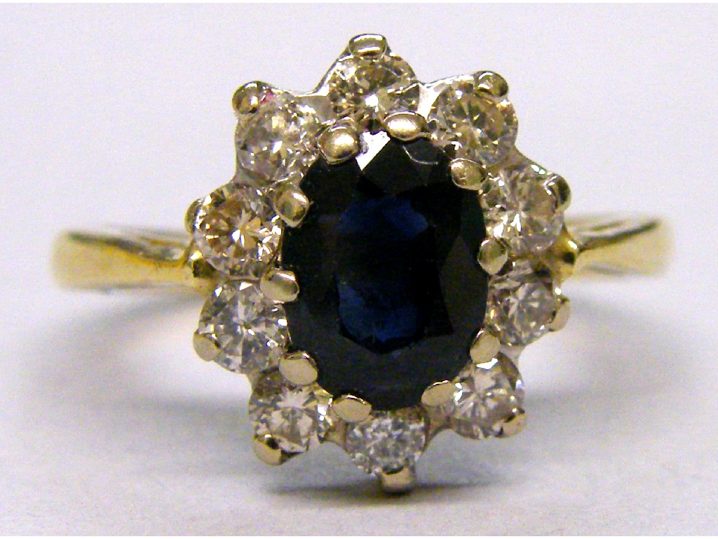 Appraisal: ct oval sapphire and diamond cluster ring set with ten