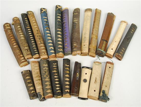 Appraisal: LARGE COLLECTION OF JAPANESE SWORD HANDLES TSUKA many wrapped in