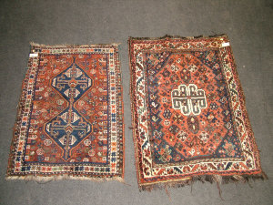 Appraisal: An Afghan rug with two medallions x cm and another