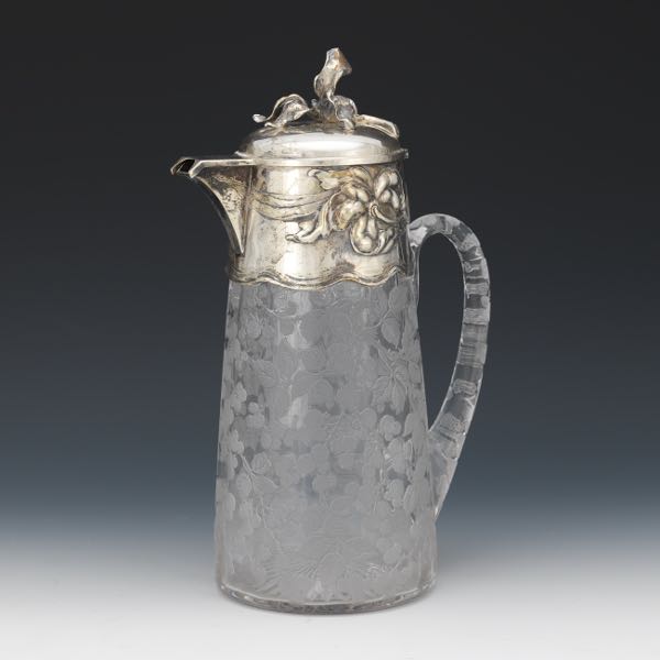 Appraisal: GLASS AND SILVER CLARET Silver top with hinged lid and