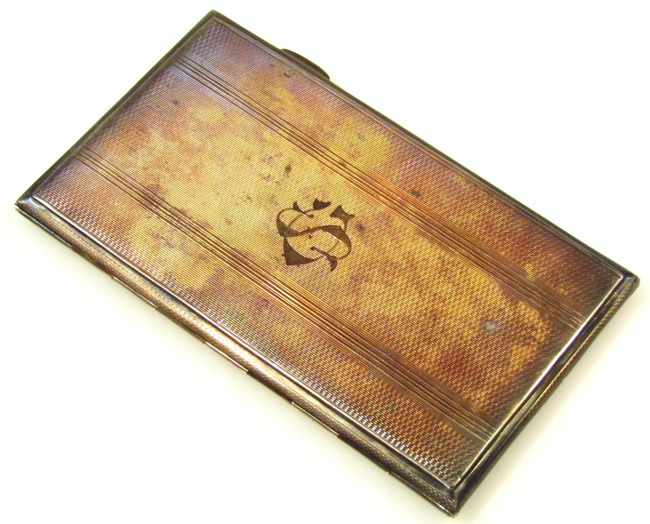 Appraisal: A George VI silver cigarette case the rectangular exterior engine