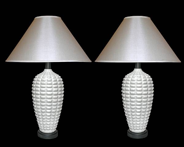 Appraisal: A pair of American white glazed earthenware lamps circa Each