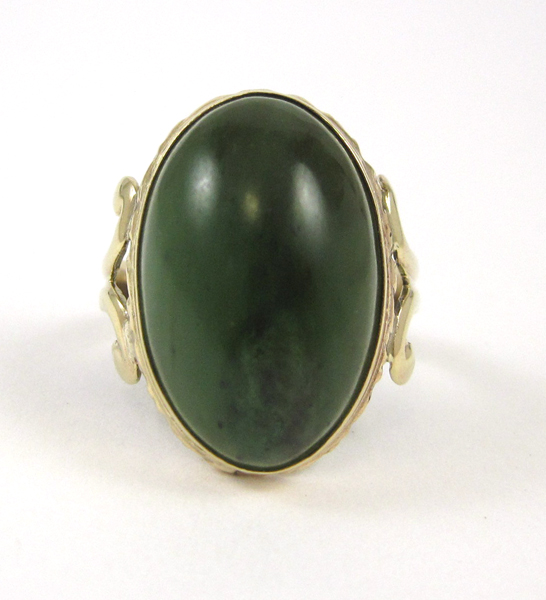 Appraisal: GREEN HARDSTONE AND TEN KARAT GOLD RING The yellow gold