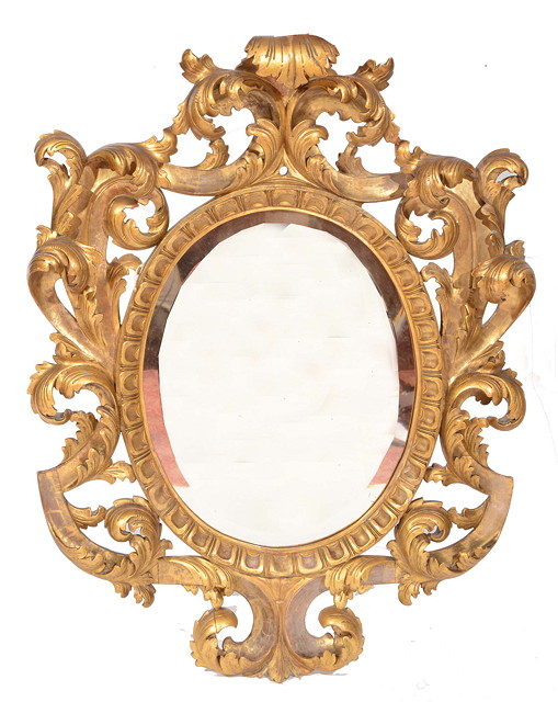 Appraisal: A CONTINENTAL GILDED HANGING WALL MIRROR in an acanthus carved