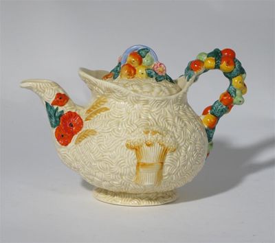 Appraisal: Celtic Harvest' a Clarice Cliff teapot and cover modelled in