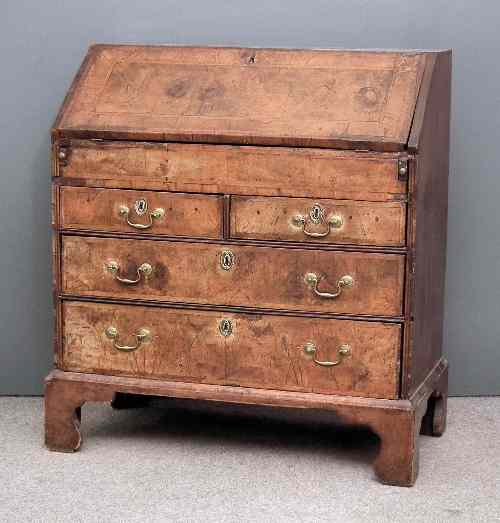 Appraisal: An th Century walnut bureau the whole crossbanded and inlaid