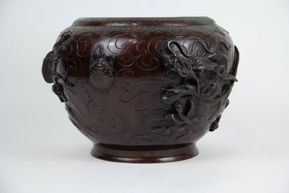 Appraisal: A Meiji Bronze 'Dragon and Phoenix' Jardiniere Cast in high