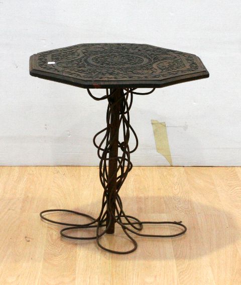 Appraisal: An unusual wrought iron and oak octagonal wine table