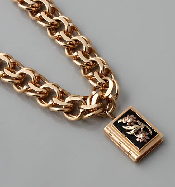 Appraisal: A k gold charm bracelet with one book charm g