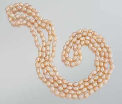 Appraisal: A Rope Length Peach Color Pearl Necklace One long rope