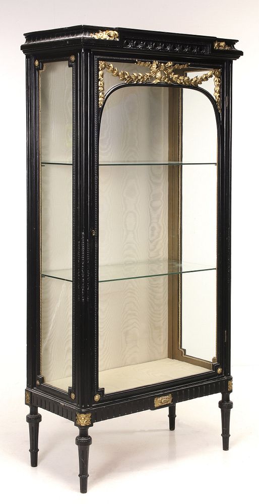 Appraisal: A LOUIS XVI REVIVAL UPRIGHT EBONISED VITRINE CIRCA The rectangular