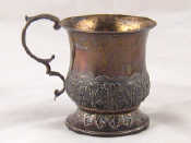 Appraisal: A Georgian silver christening mug decorated with stiff leaved acanthus