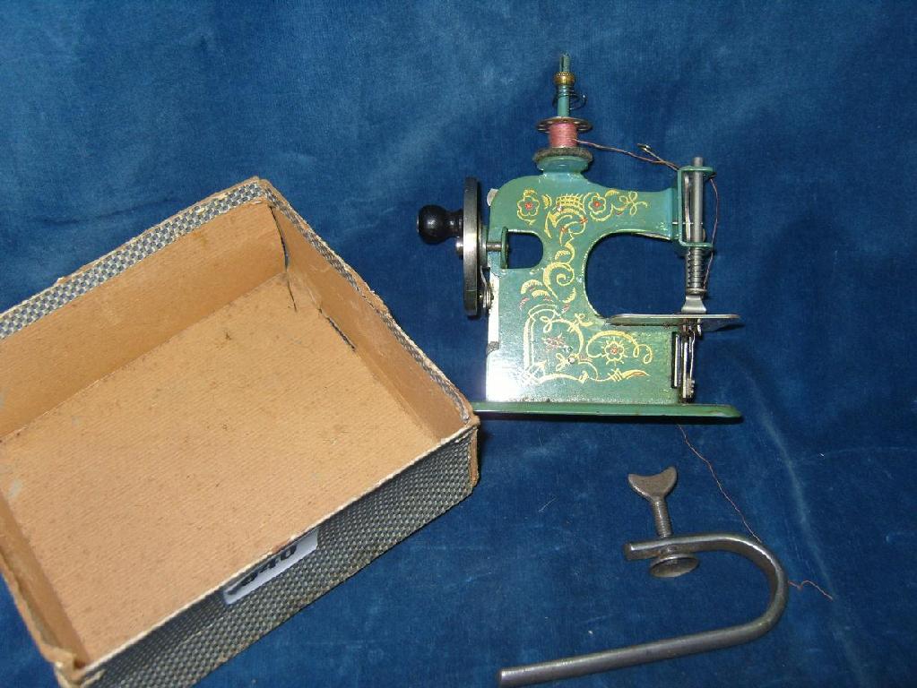 Appraisal: A miniature early th century German made toy sewing machine