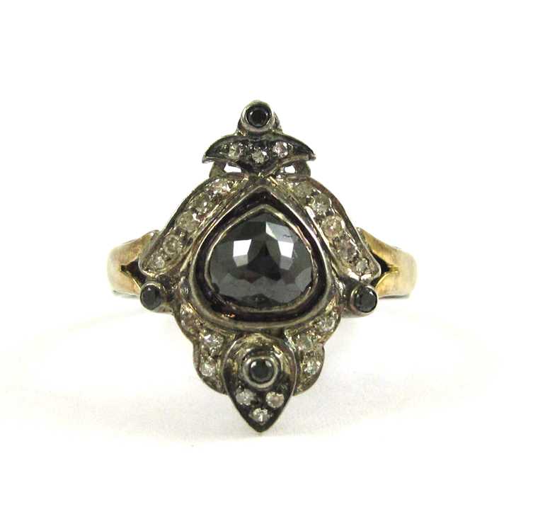 Appraisal: INDIA BLACK DIAMOND SILVER AND YELLOW GOLD RING The sterling