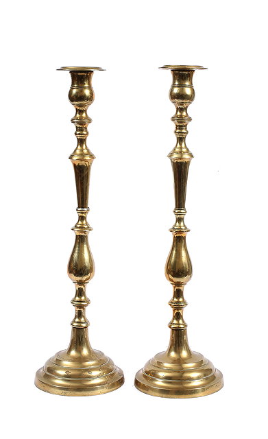 Appraisal: A PAIR OF LARGE TURNED BRASS CANDLESTICKS with knopped and