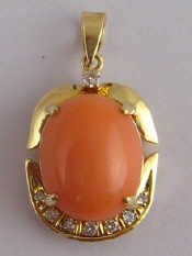 Appraisal: A yellow metal tests carat gold coral and diamond pendant