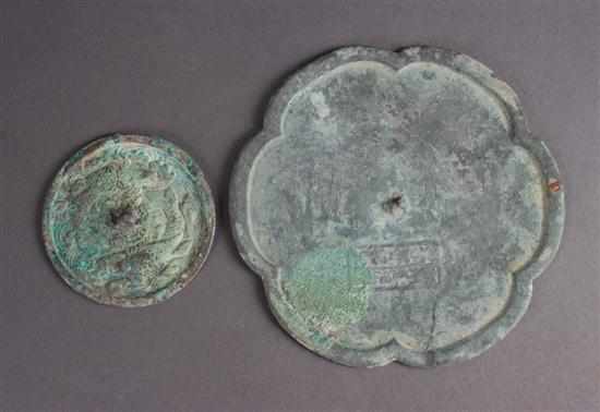 Appraisal: Pair of Chinese bronze mirrors Tang Dynasty Lobed rim the