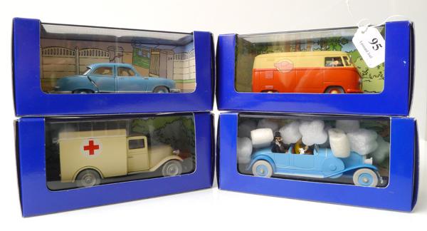 Appraisal: FOUR EN VOITURE TINTIN FIGURES FROM TINTIN COMICS RELEASED IN