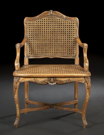 Appraisal: Provincial Louis XV-Style Fruitwood Fauteuil third quarter th century the