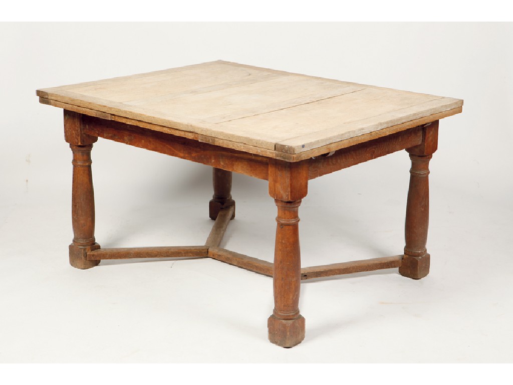 Appraisal: HEALS A LIGHT OAK DRAWER-LEAF DINING TABLE the rectangular panelled