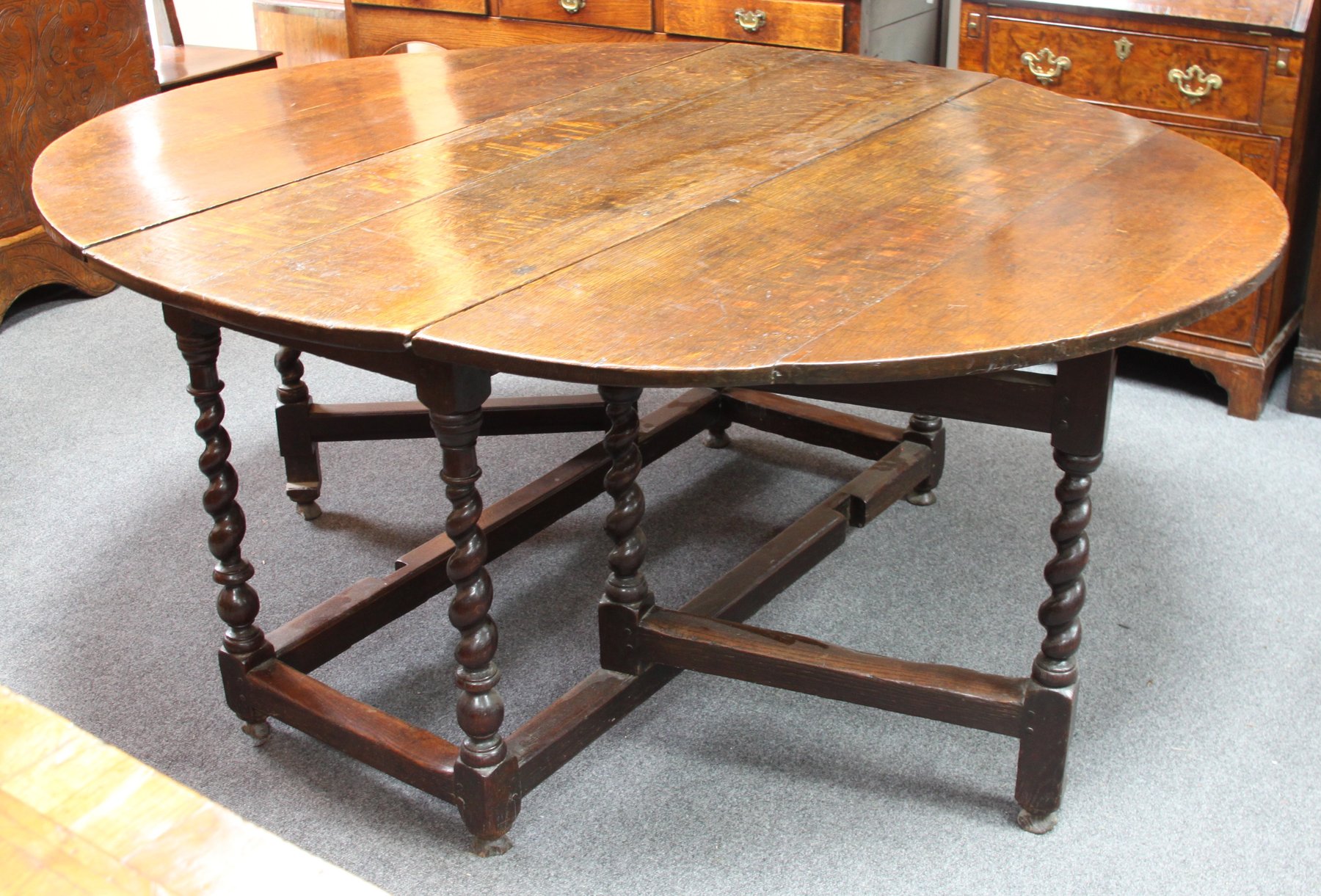 Appraisal: A late th Century oak gateleg table the oval two-flap