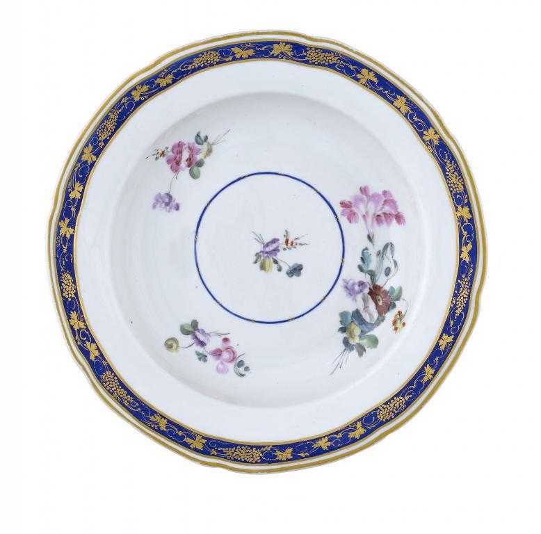 Appraisal: A CHELSEA-DERBY SOUP PLATE painted with principal and subsidiary flower