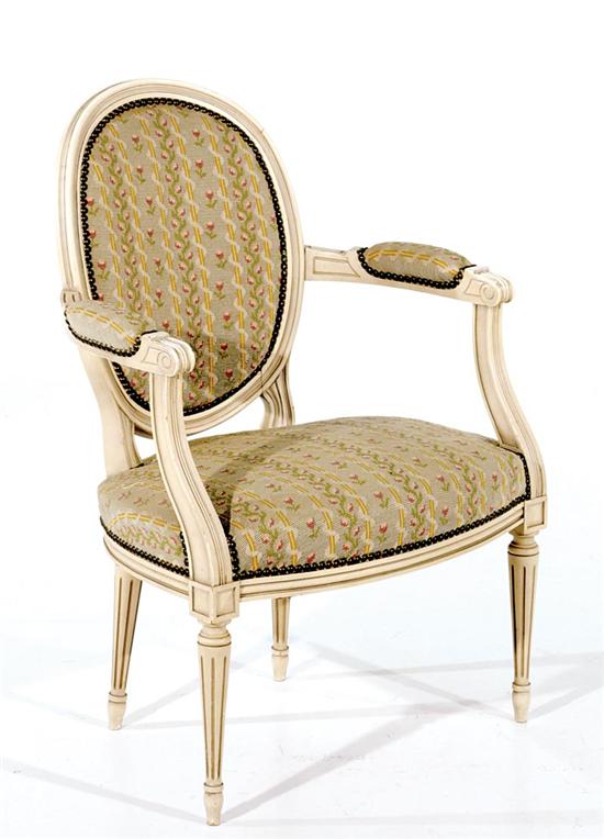 Appraisal: Louis XVI style painted fauteuil th century oval needlework back