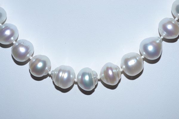 Appraisal: A STRAND OF BAROQUE STERLING SILVER PEARLS TO A SILVER