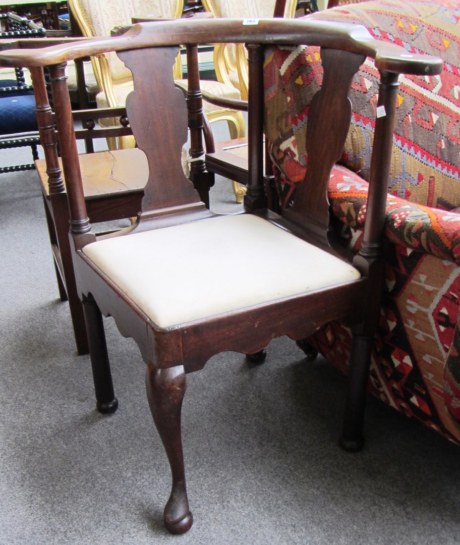 Appraisal: A mid th century mahogany double vase back corner chair