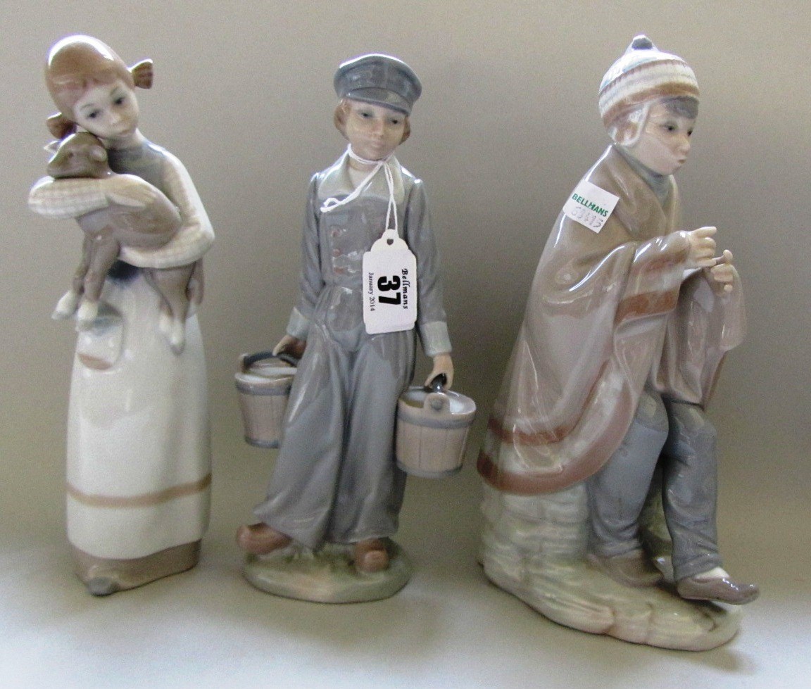 Appraisal: Two Lladro figures modelled as a young Dutch boy and