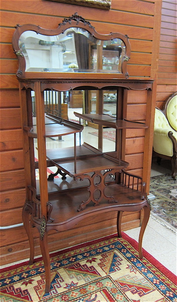 Appraisal: LATE VICTORIAN CHERRY ETAGERE American c with beveled mirror crest