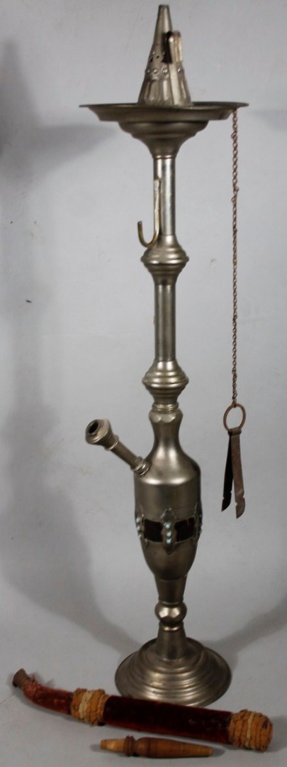 Appraisal: A metal opium style stand with pipe fitting on stepped