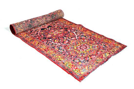 Appraisal: ORIENTAL RUNNER Salmon field with floral medallions and triple border